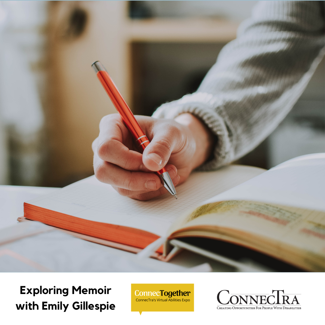 Close-up of a person holding a pen and writing in a book.